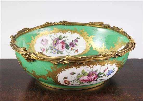 A pair of Sevres porcelain green ground bowls, c.1773, diameter incl. mounts 24cm (9.5in.), some decoration possibly later